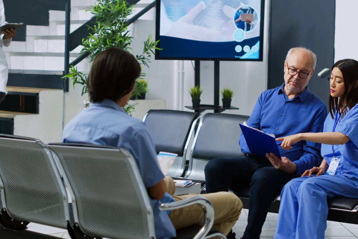 A medical team assisting patients in a waiting area, representing Concierge Contact Center’s commitment to combining attentive human care with seamless, efficient service.